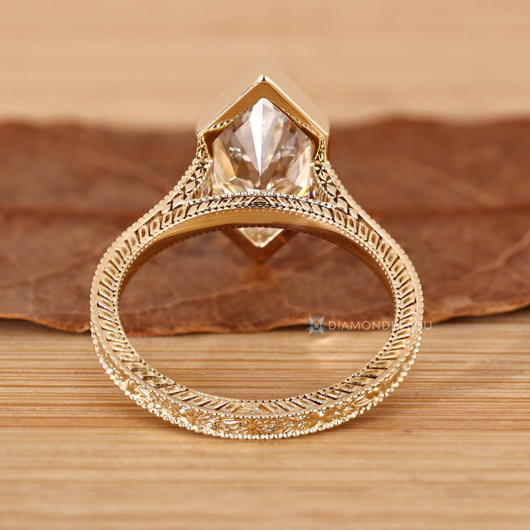 IGI certified lab grown diamond with a bezel setting.
