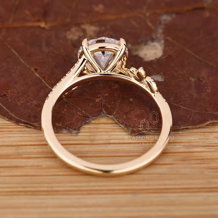 Round old european cut diamond ring with leaf design and four prong setting.

