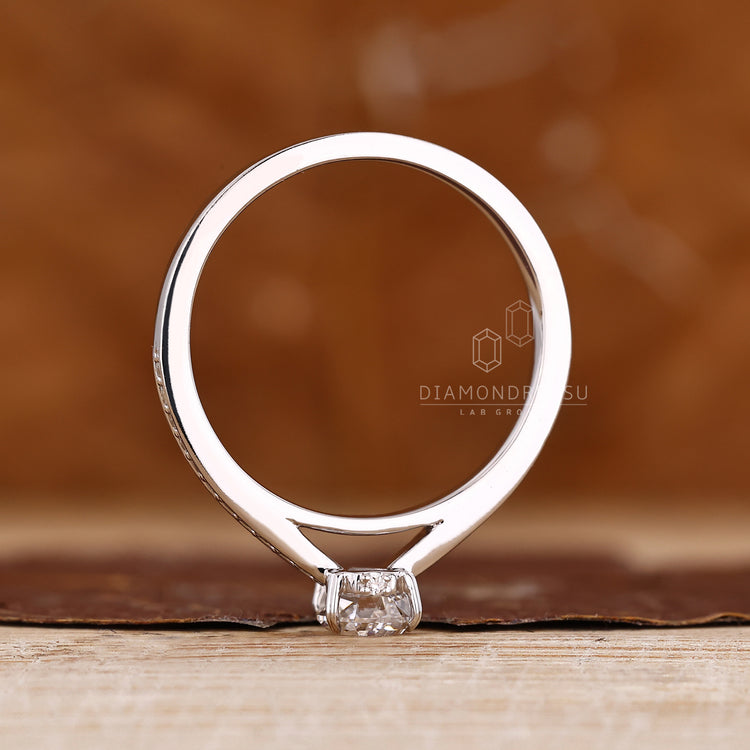 Diamondrensu coffin ring with lab grown diamond center stone.