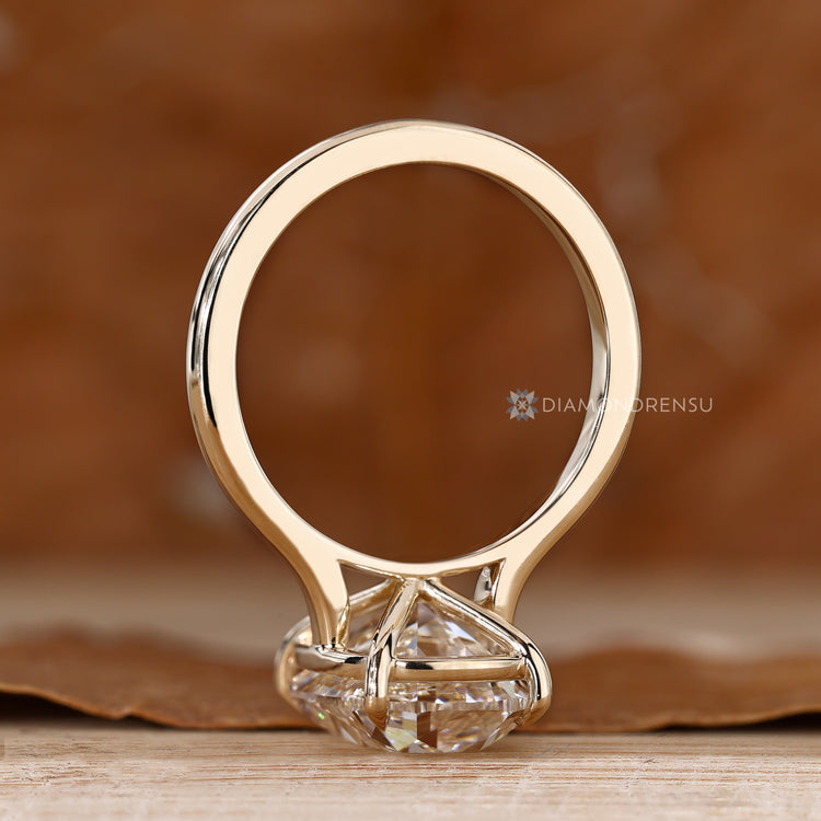 Solitaire style lab grown cushion old mine cut diamond ring.
