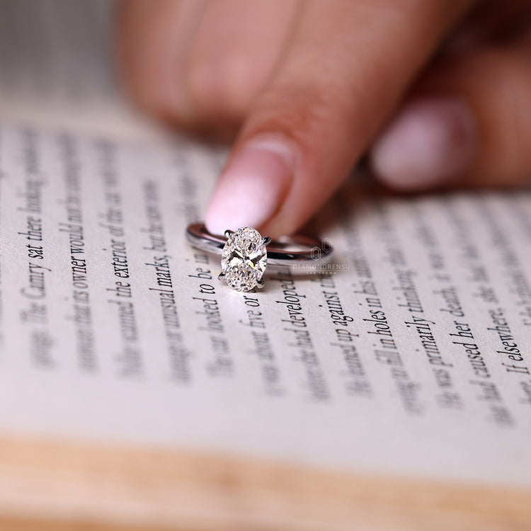 IGI certified oval diamond engagement ring with lab grown diamond.