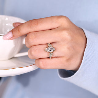 Nature inspired marquise ring with round pave band and accents.