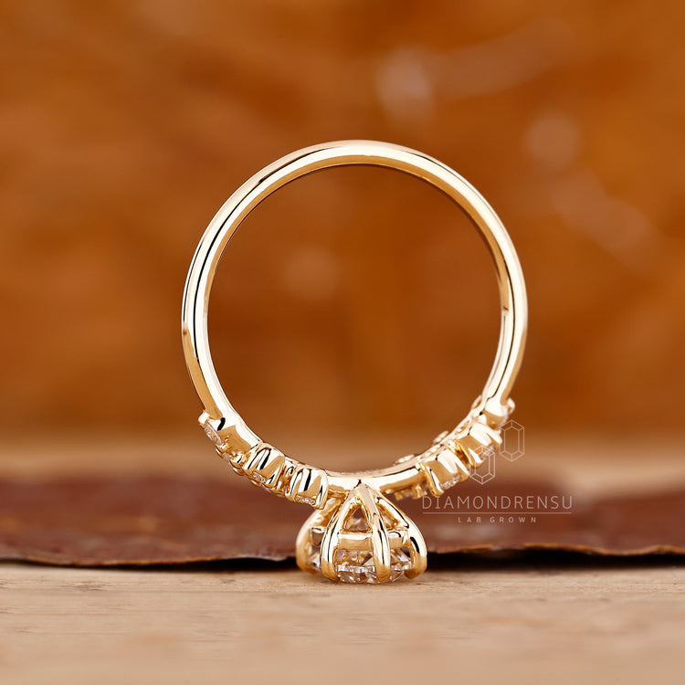 IGI certified oval diamond ring with cluster setting.