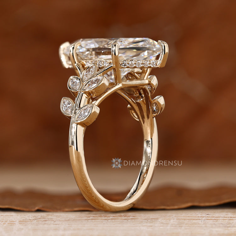 Dutch marquise engagement ring with six claw prongs and a hidden halo.