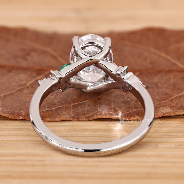 IGI certified oval engagement ring with a cluster setting.