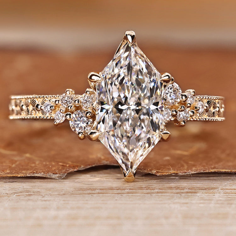 Dutch marquise ring with vintage style and round side stones.