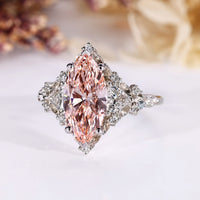 Pink marquise diamond ring with V prong setting.