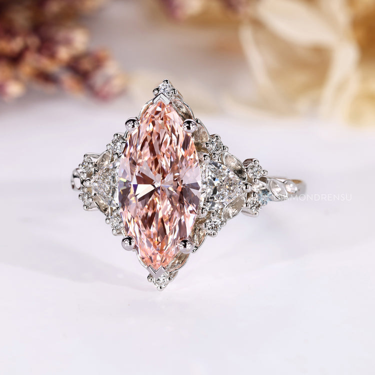 Pink marquise diamond ring with V prong setting.