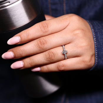 Handmade coffin engagement ring with cathedral setting.