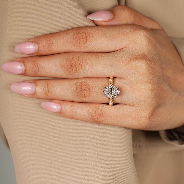 Cushion cut diamond ring with a twisted shank and marquise stones.