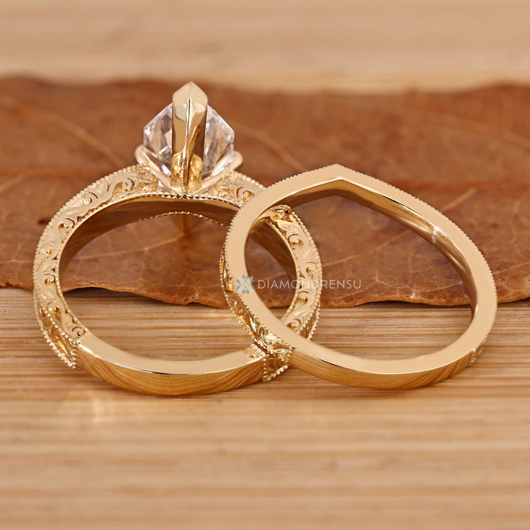 Dutch marquise bridal set with a pinch shank and milgrain details.