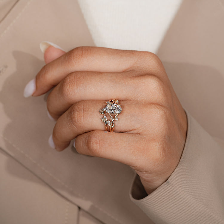 Oval bridal set with round side stones and a split shank.