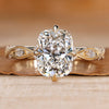 Cushion cut diamond ring with a twisted shank.