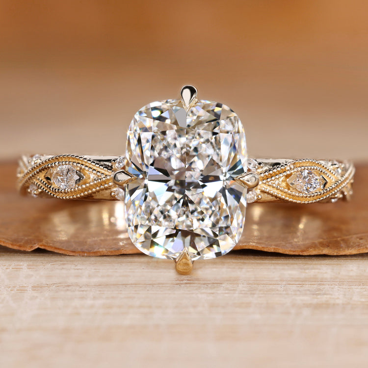 Cushion cut diamond ring with a twisted shank.