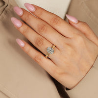 Cushion cut diamond ring with milgrain details.