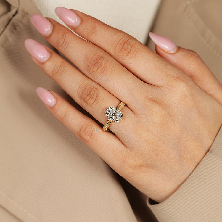 Cushion cut diamond ring with milgrain details.