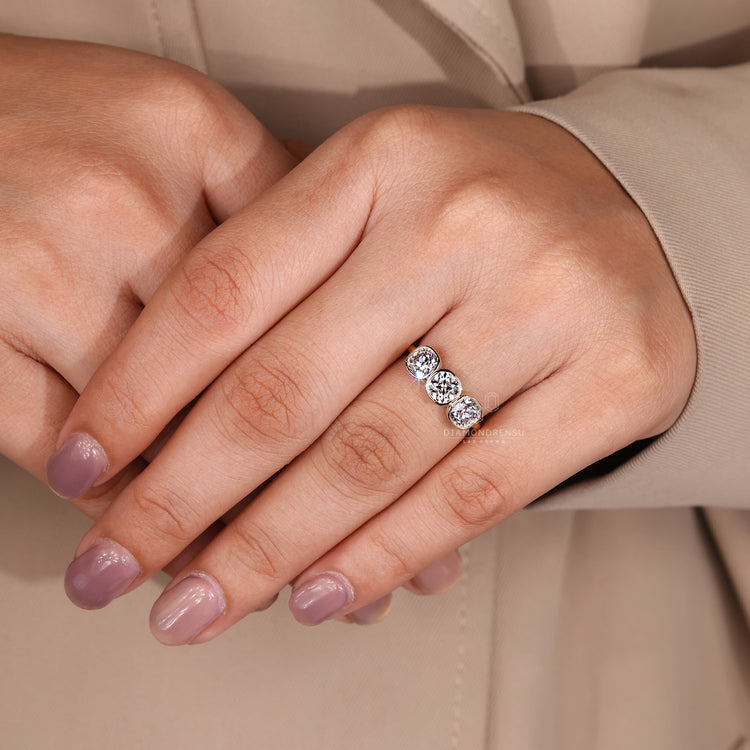 Classic three stone ring with cushion old european diamond.
