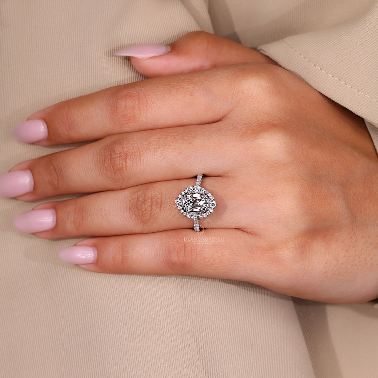 Handmade diamond ring with cushion old mine center and halo design.
