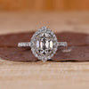Cushion old mine cut diamond with round cut halo and pave band by Diamondrensu.
