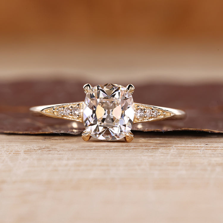 Old Mine Cut Diamond Ring With Round Side Stones.
