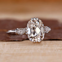 Elegant ring with cushion old mine center and cathedral band design.
