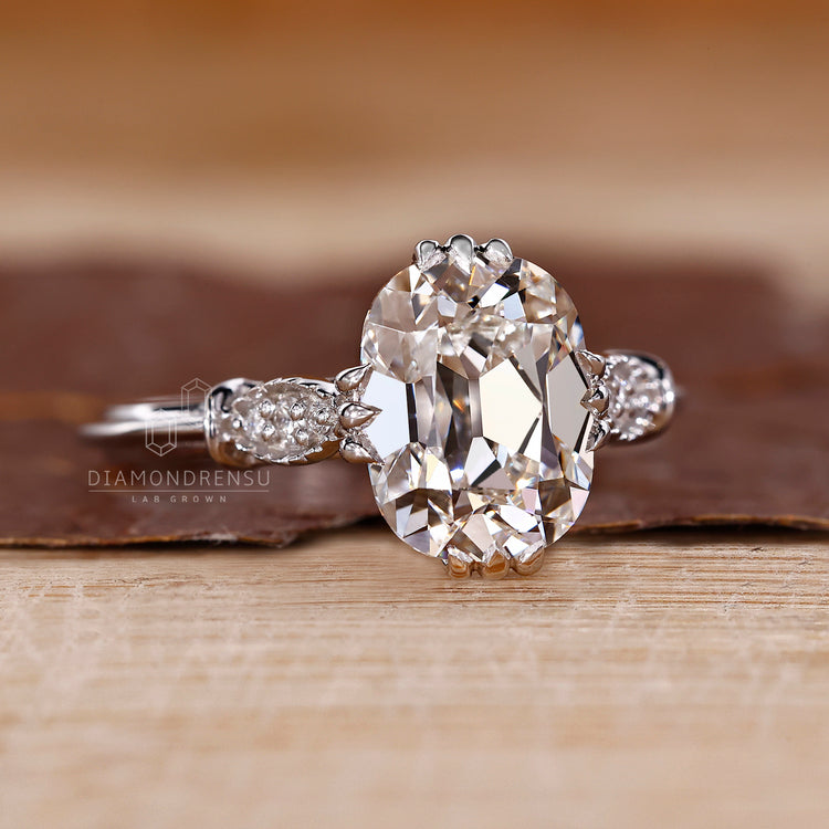 Elegant ring with cushion old mine center and cathedral band design.
