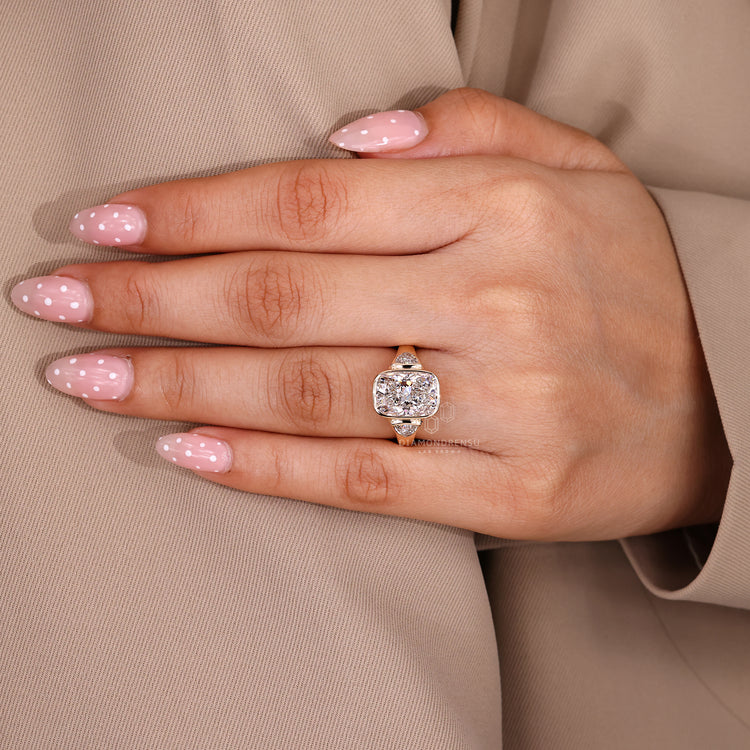 Lab grown three diamond ring with tapered shank.
