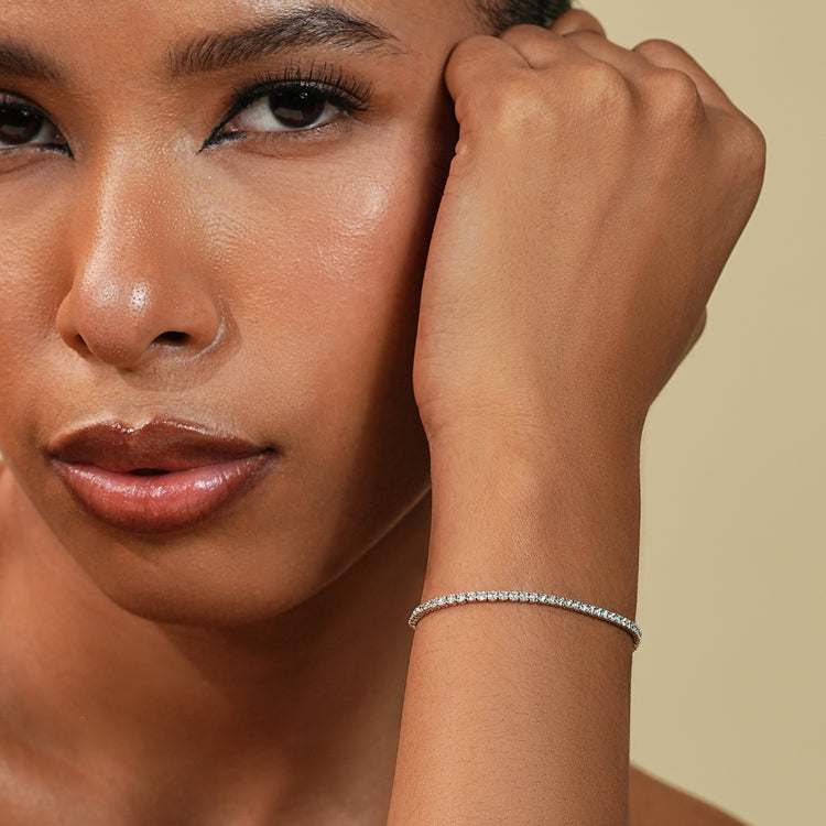 Round cut diamond bracelet with 2 carat stones.
