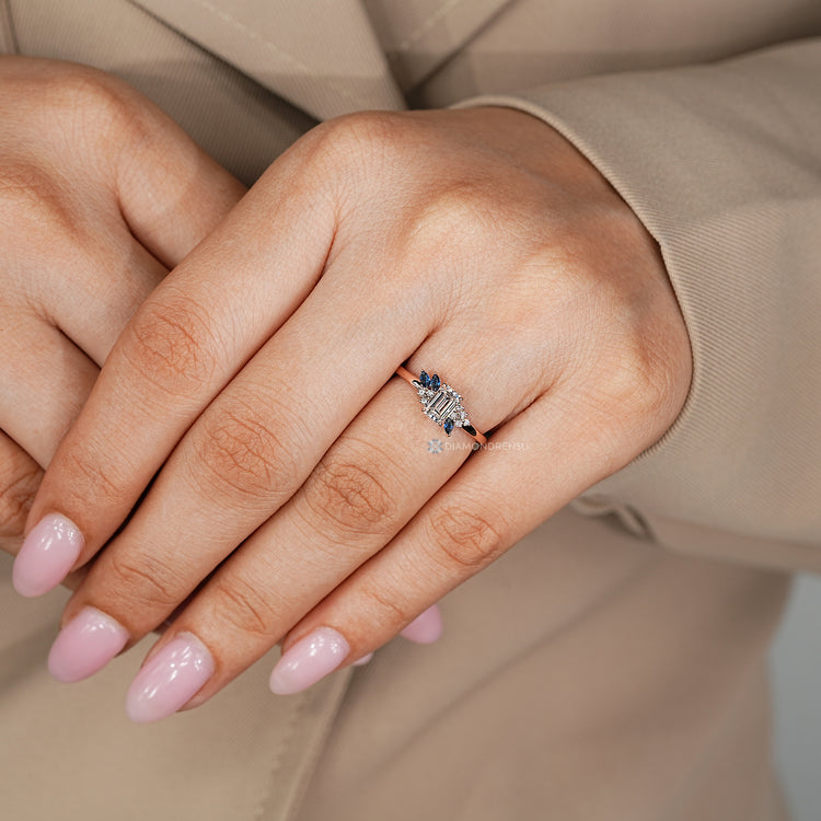 Handmade lab grown diamond ring with an emerald center stone.