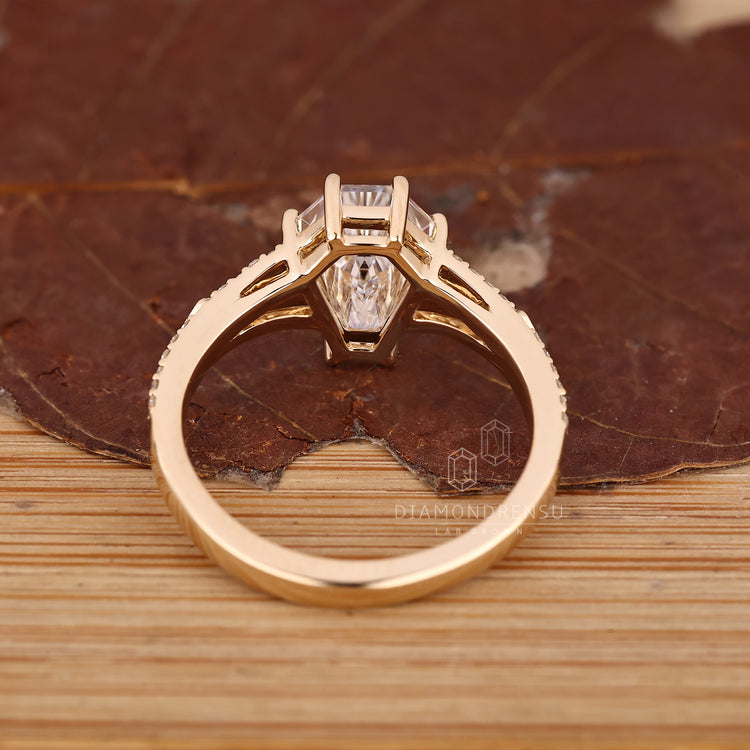 Handmade coffin ring with cathedral setting and prong design.