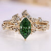 Green Dutch marquise bridal set with round side stones.