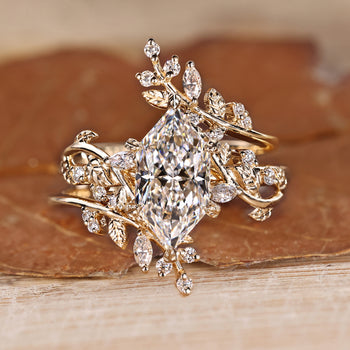Dutch marquise bridal set with marquise and round side stones.