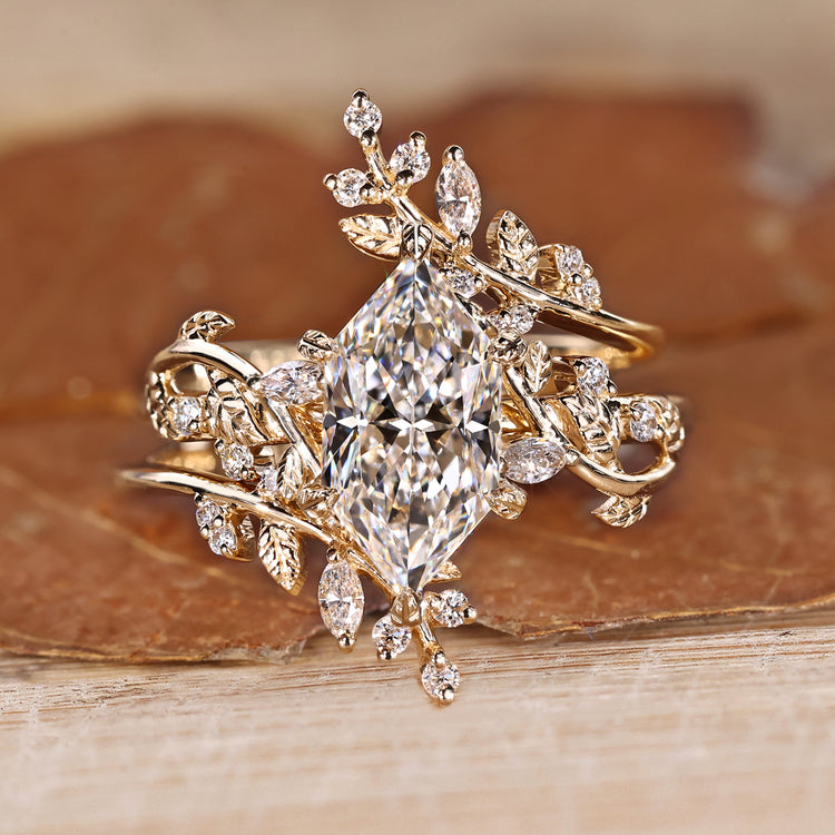 Dutch marquise bridal set with marquise and round side stones.