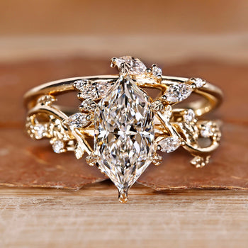Dutch marquise diamond engagement ring with wedding band.