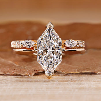 Dutch marquise wedding ring with hidden halo and round accents.
