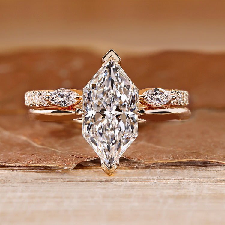 Dutch marquise wedding ring with hidden halo and round accents.