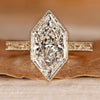 Art Deco engagement ring with Dutch marquise center stone and milgrain details.