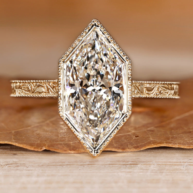Art Deco engagement ring with Dutch marquise center stone and milgrain details.
