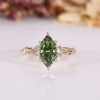 Dutch marquise ring with nature inspired design and round side stones.
