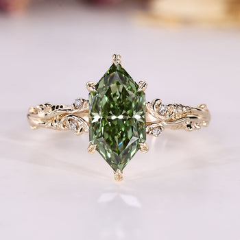 Dutch marquise ring with nature inspired design and round side stones.
