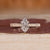 Dutch marquise ring in solitaire style with ocean waves design band.