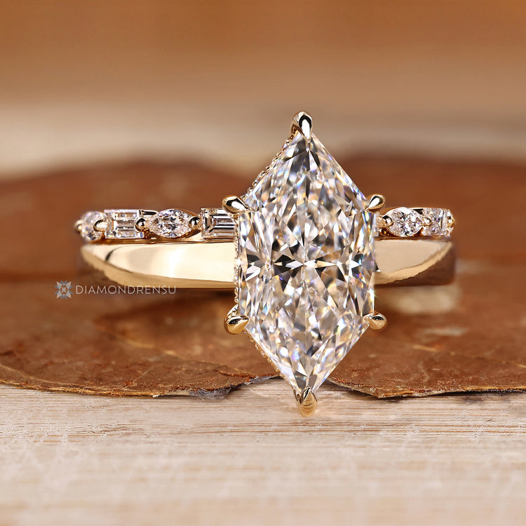 Six claw prong setting secures the center stone.