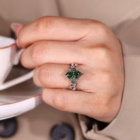 Lab grown green diamond ring with nature inspired design.