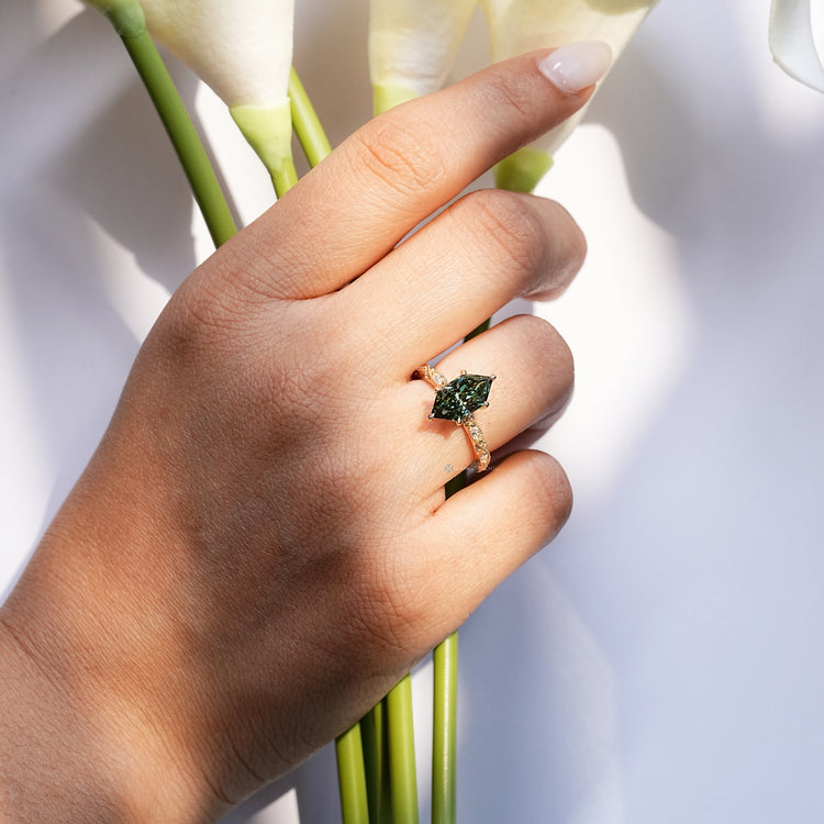 Dutch marquise diamond ring with a six claw prong setting.