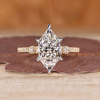 Dutch marquise engagement ring with round cut pave band and hidden halo.