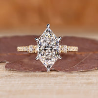 Dutch marquise engagement ring with round cut pave band and hidden halo.