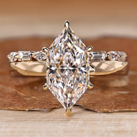 Dutch marquise wedding ring with round cut hidden halo.