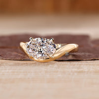 Diamondrensu oval ring with lab grown diamond center stone.