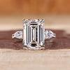 Emerald cut lab grown diamond ring with pear side stones.

