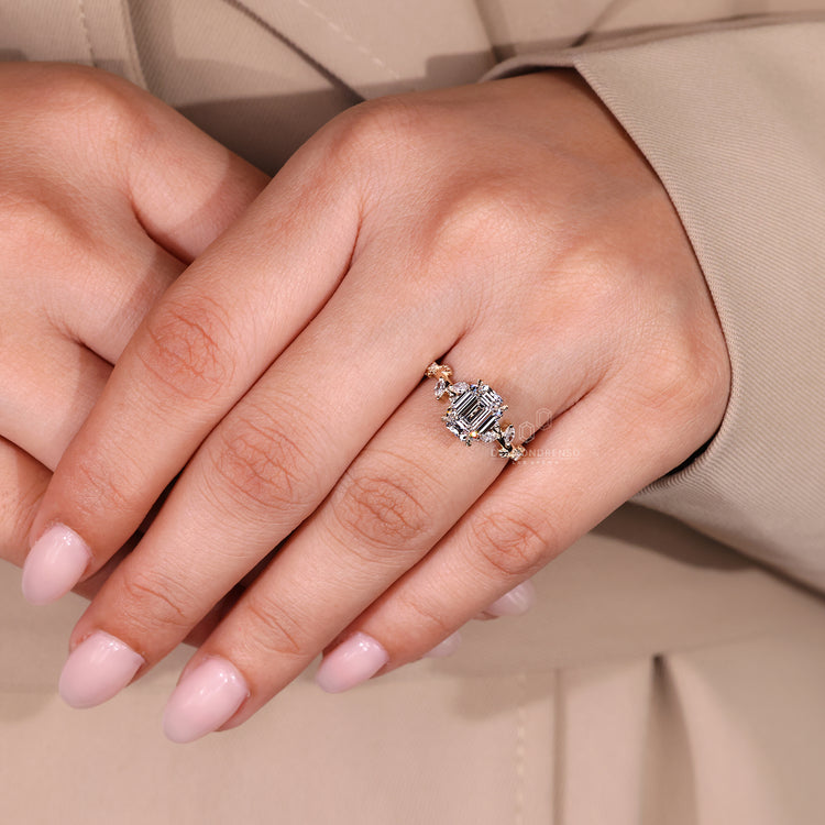 Emerald old european cut diamond ring with marquise and round accents.
